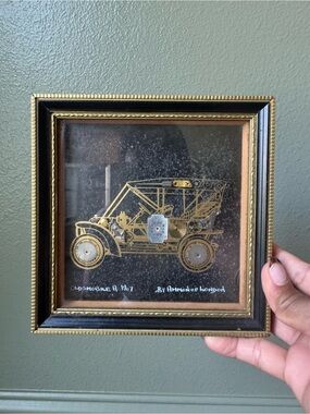 vintage 1970s framed horological collage depicting a 1907 Oldsmobile A Tourer,
s